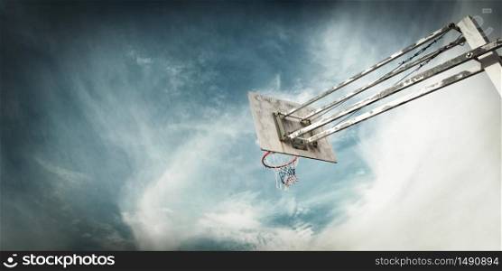 Outdoor Basketball basket against a blue sky