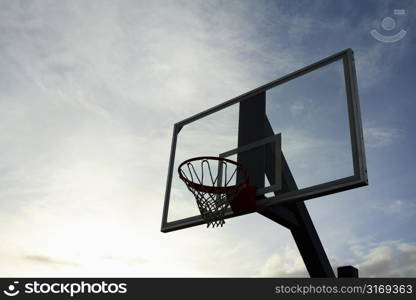 Outdoor basketball hoop on a cloudy day