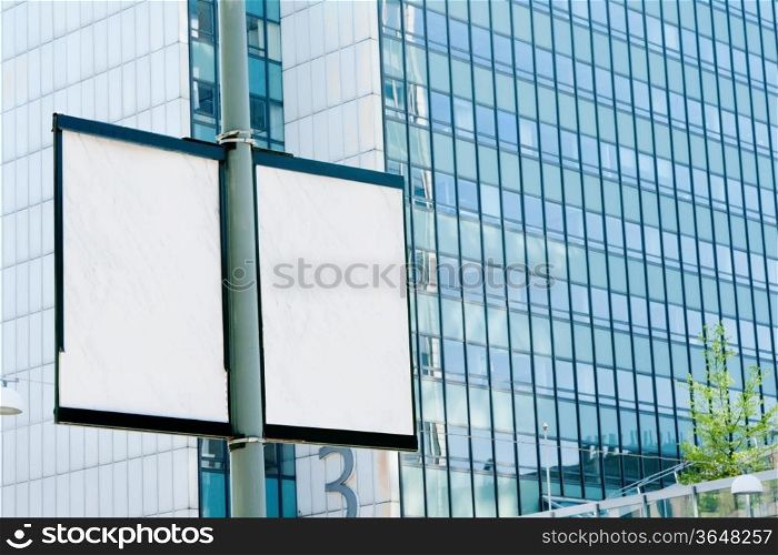 Outdoor billboards in the background of an office building
