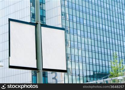Outdoor billboards in the background of an office building
