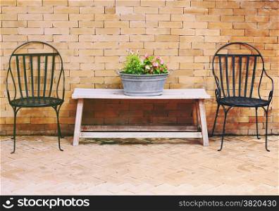 Outdoor chairs and flower for decorated with retro filter effect