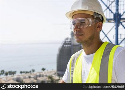 outdoor construction worker wearing safety glasses helmet