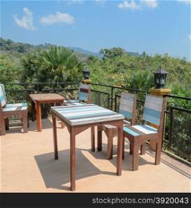Outdoor deck and patio furniture with mountain view. Southern Thailand