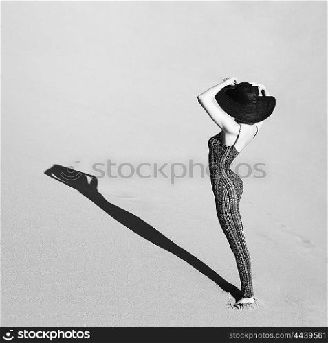 Outdoor fashion art photo of dancing slender young woman in overall a fine ornament