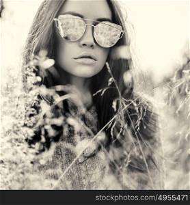 Outdoor fashion photo of young beautiful lady in autumn landscape