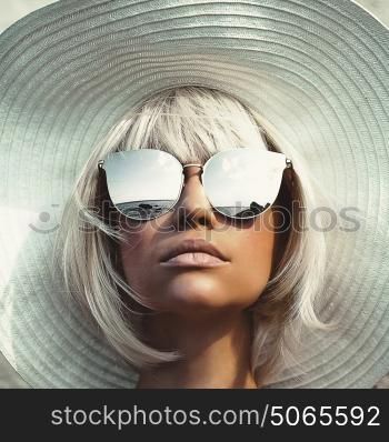 Outdoor fashion photo of young beautiful lady in hat and sunglasses. Summer Beach travel. Summer vibes