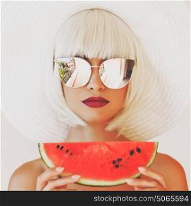 Outdoor fashion photo of young beautiful lady in hat and sunglasses with watermelon. Summer Beach travel. Summer vibes