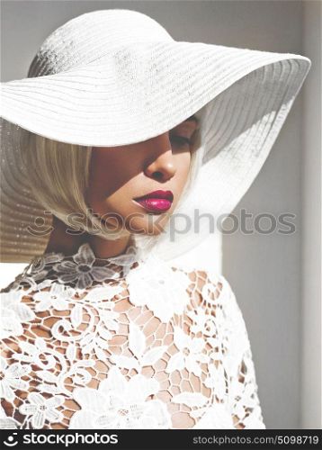 Outdoor fashion photo of young beautiful lady in white hat. Summer Beach travel. Summer vibes