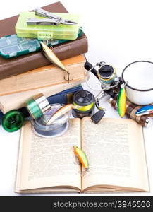 outdoor fishing tackles and baits with books on white background