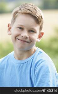 Outdoor Head And Shoulder Portrait Of Smiling Boy