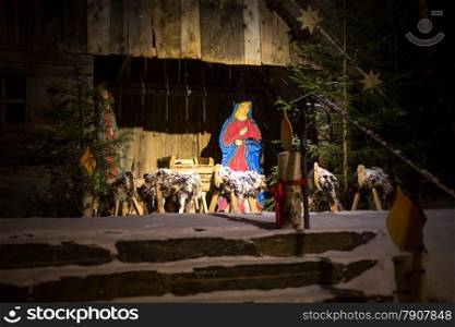 Outdoor photo at night of scene of Jesus birth in stable