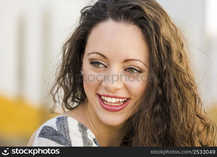 Outdoor portrait of a beautiful and fresh young woman