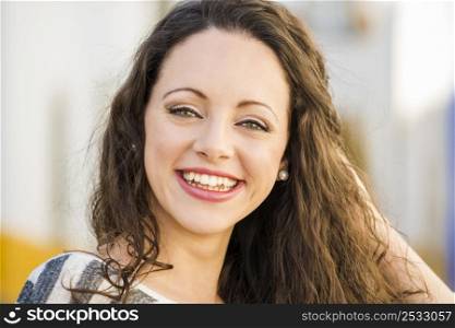 Outdoor portrait of a beautiful and fresh young woman