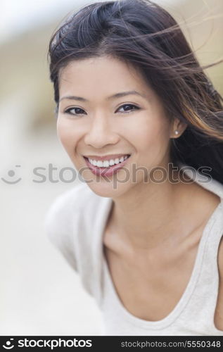 Outdoor portrait of a beautiful young Chinese Asian young woman or girl