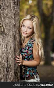 Outdoor portrait of a beautiful young girl. Blonde Girl