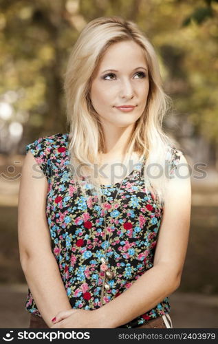 Outdoor portrait of a beautiful young girl. Blonde Girl