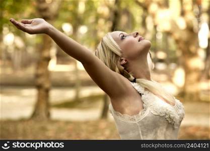 Outdoor portrait of a beautiful young girl. Blonde Girl