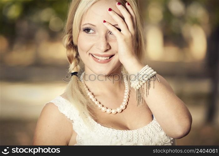 Outdoor portrait of a beautiful young girl laughing