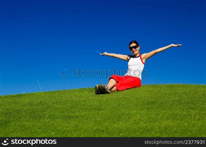 Outdoor portrait of a beautiful young woman enjoying the spring  
