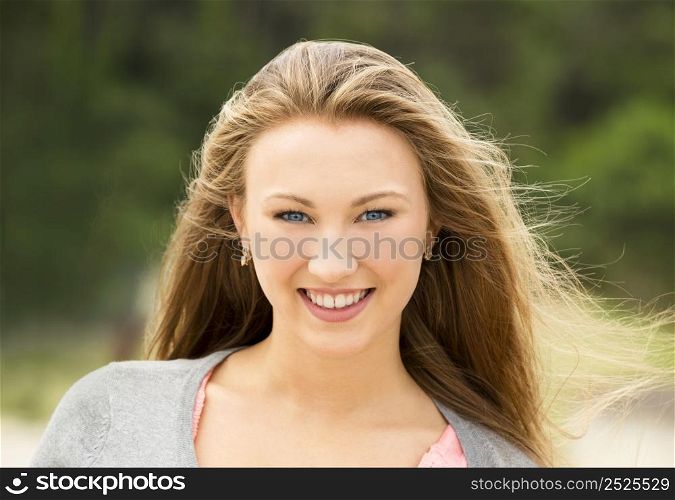 Outdoor portrait of a happy and beautiful teenage girl
