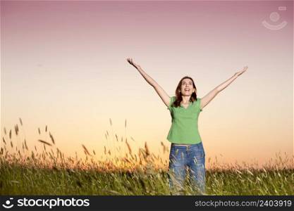 Outdoor portrait of a woman on a meadow releaxing