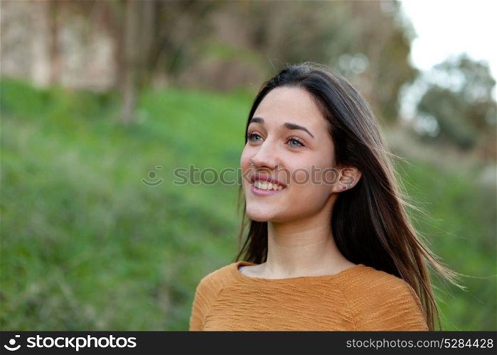 Outdoor portrait of beautiful happy teenager girl
