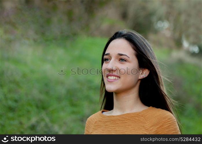 Outdoor portrait of beautiful happy teenager girl