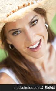 Outdoor Portrait of Beautiful Young Woman In Straw Cowboy Hat