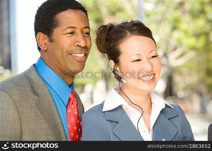 Outdoor portrait of businesspeople, smiling