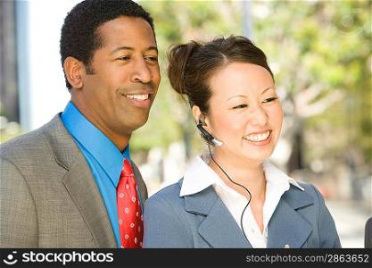 Outdoor portrait of businesspeople, smiling