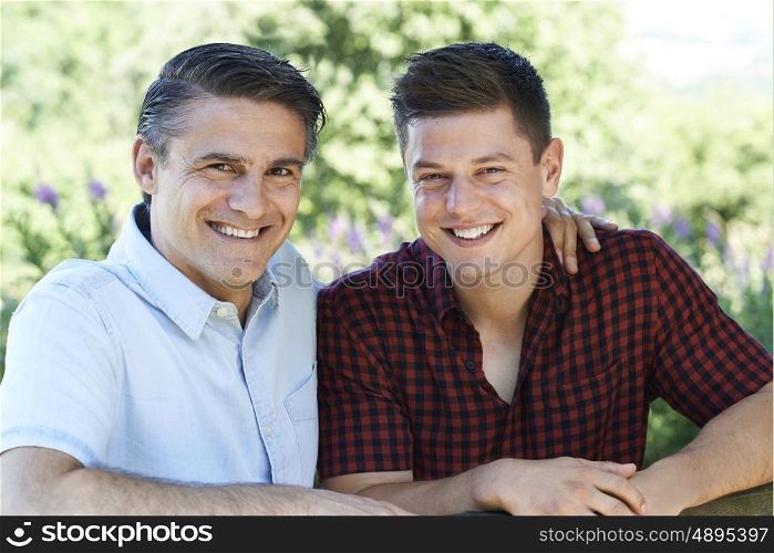 Outdoor Portrait Of Father With Adult Son