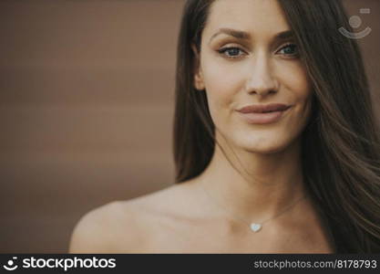 Outdoor portrait of sensual long hair brunette woman