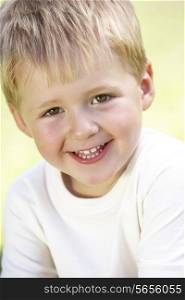 Outdoor Portrait Of Smiling Young Boy