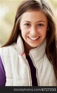 Outdoor Portrait Of Teenage Girl Wearing Winter Clothes