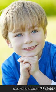 Outdoor Portrait Of Young Boy In Countryside