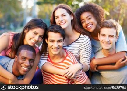 Outdoor Portrait Of Young Friends Having Fun In Park