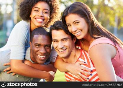 Outdoor Portrait Of Young Friends Having Fun In Park