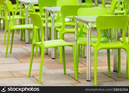 Outdoor restaurant coffee open air cafe green chairs with table. Summer vacation on resort