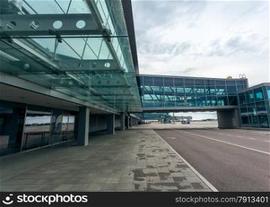 Outdoor shot of modern airport terminal made of steel and glass