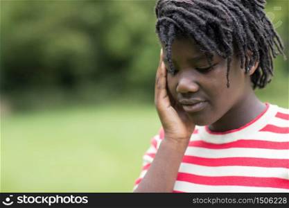 Outdoor Shot Of Stressed Teenage Girl