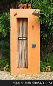 Outdoor shower near swimming pool in tropical style