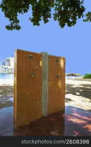 Outdoor showers on an empty beach, Condado Beach, San Juan, Puerto Rico