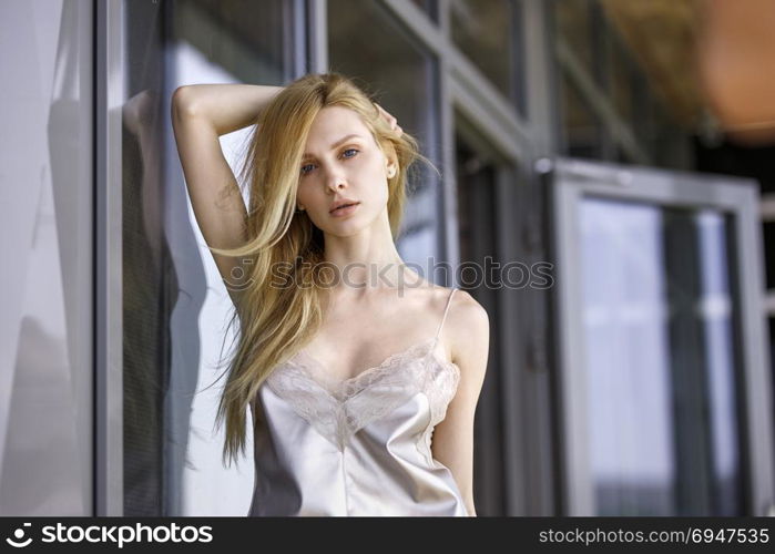 Outdoor summer portrait of fashionable woman in nice dress . Outdoor summer portrait of fashionable woman in nice dress.