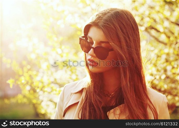 Outdoor summer portrait of young beautiful pretty girl posing in sunset lovely light