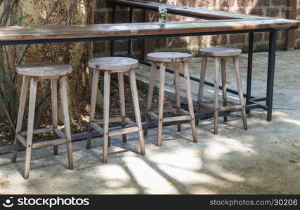 Outdoor wooden tables and chairs, stock photo