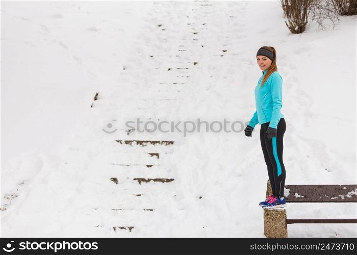 Outdoors activities people spare time concept. Young woman outside during winter. Attractive girl has blue jumper and leggins.. Young woman outside during winter.