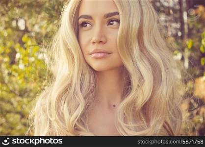 Outdoors portrait of beautiful romantic lady with magnificent healthy hair