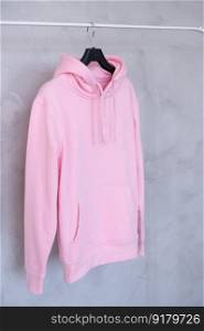 Outerwear, Closet order, Pink sweatshirt, Old things, Men&rsquo;s sweater, Women&rsquo;s sweatshirt, Unisex clothing, Large size, children&rsquo;s clothing. A set of layouts of a pink hoodie with a hood and a pocket hanging on a hanger
