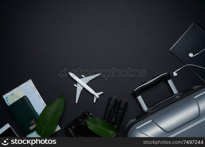 Outfit ,accessories and equipment of traveler on black background with copy space . Summer vacation concept