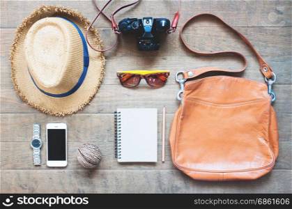 Outfit of traveler, camera, mobile device, sunglassses. Overhead shot of essentials for traveler, Travel concept